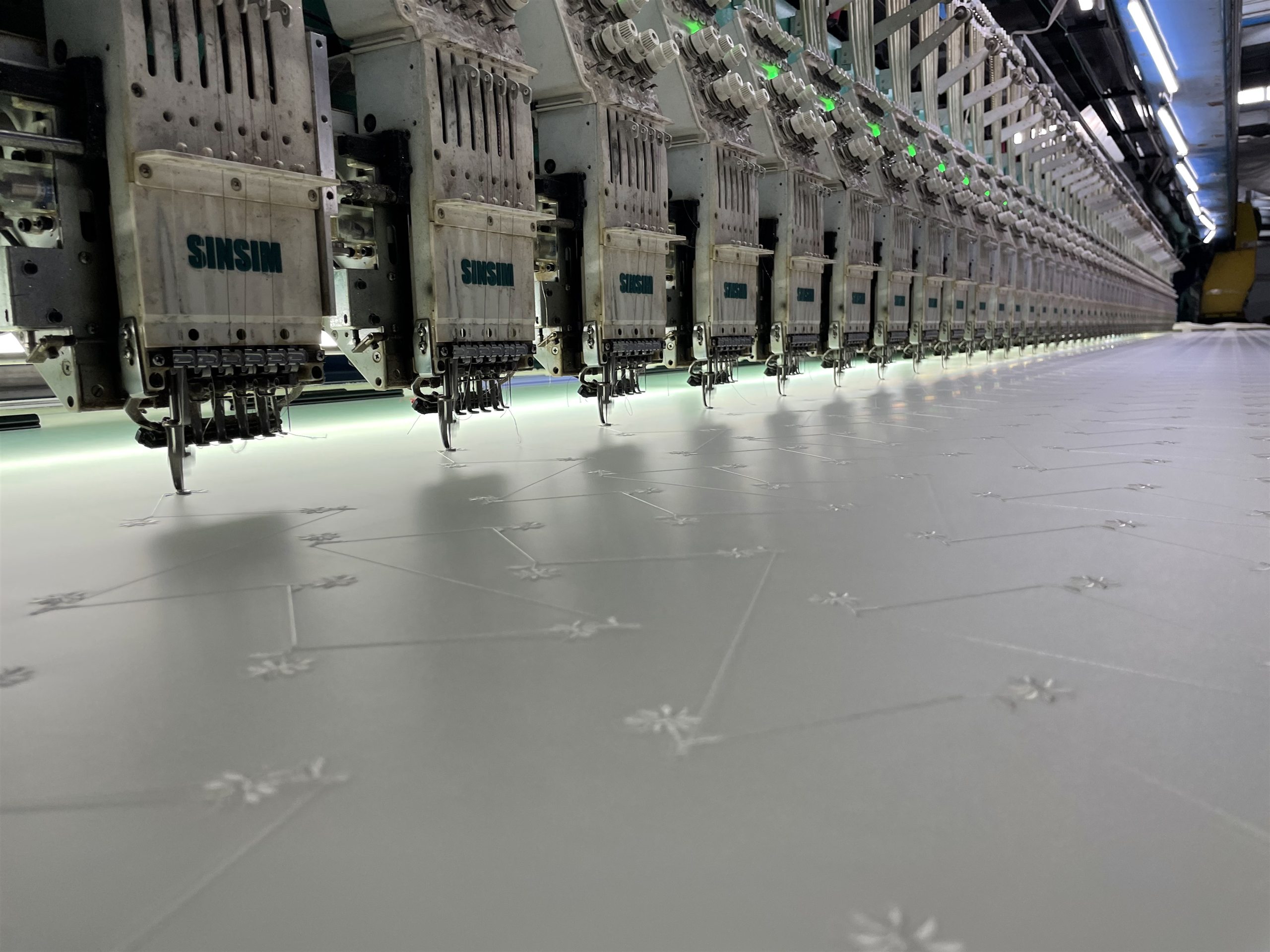 Amber embroidery fabric production and development
