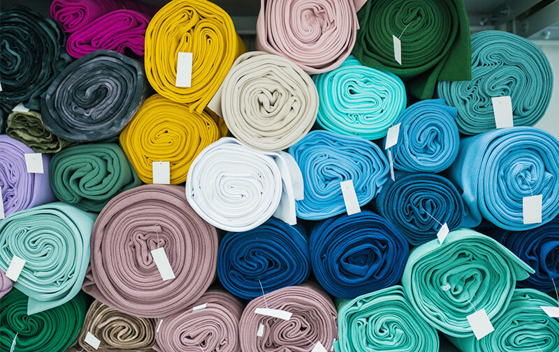 Shop owner selecting fabrics